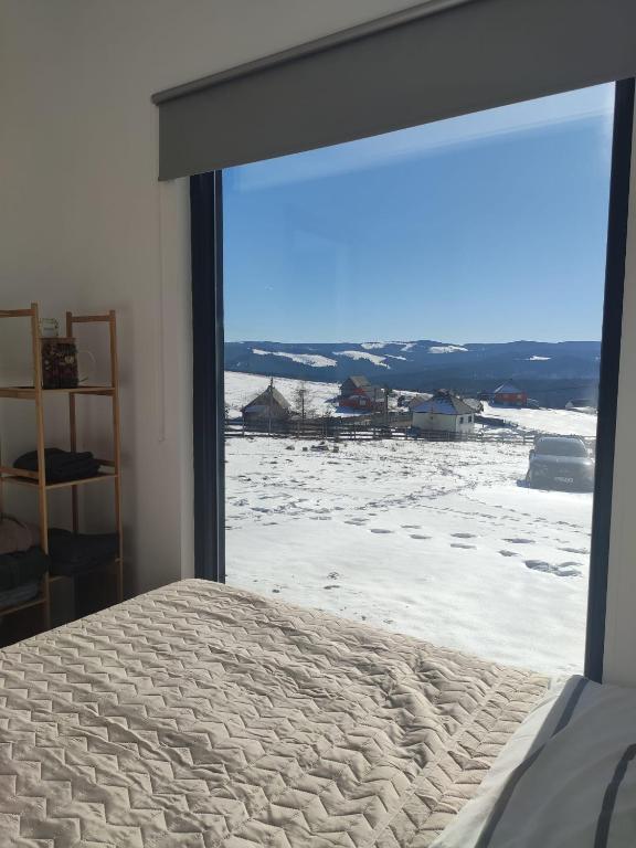 Postel nebo postele na pokoji v ubytování Tiny House Maguri