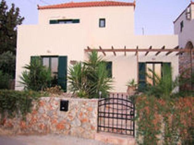 a white house with a gate in front of it at Vista and Vista II, Kokino Chorio, Crete- two adjacent villas presented by Ourvillasincrete in Kókkinon Khoríon