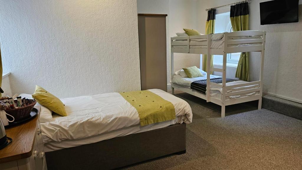 Postel nebo postele na pokoji v ubytování Hotel Rudyard