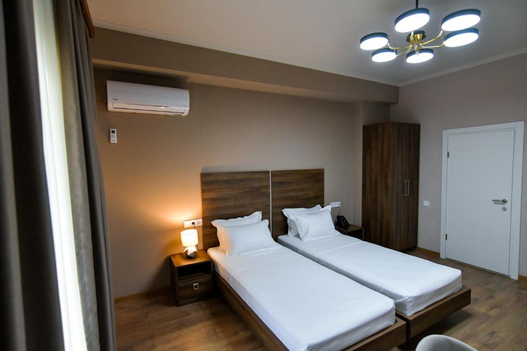 Postel nebo postele na pokoji v ubytování Gelati Residence