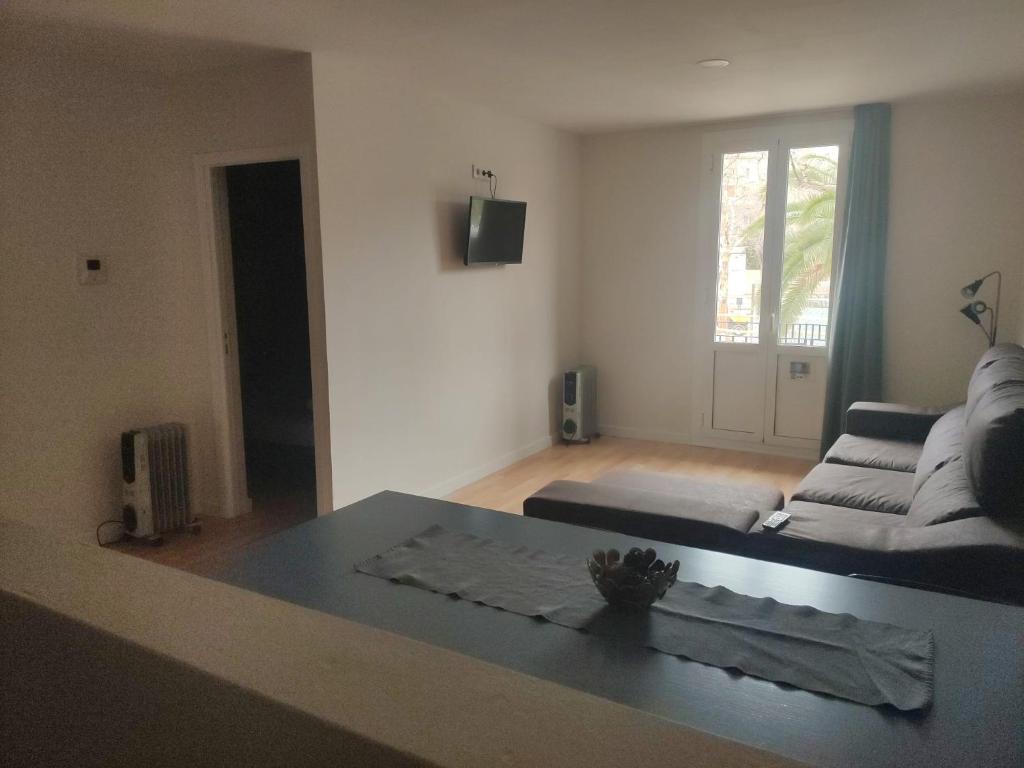 Televízia a/alebo spoločenská miestnosť v ubytovaní Diagonal Apartments