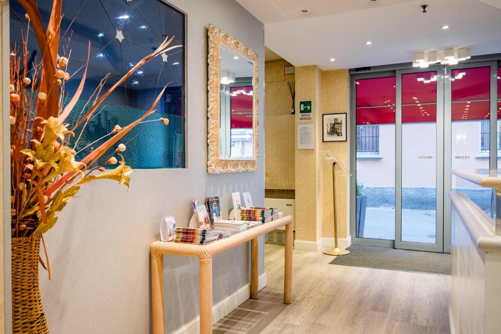 a dressing room with a counter and a mirror at Hotel Centrale in Bologna