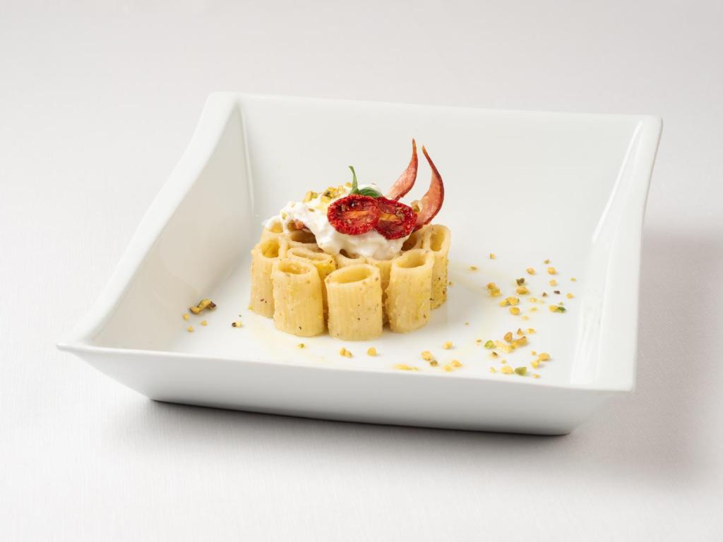 a plate of food with at Albatros Beach Hotel in Letojanni