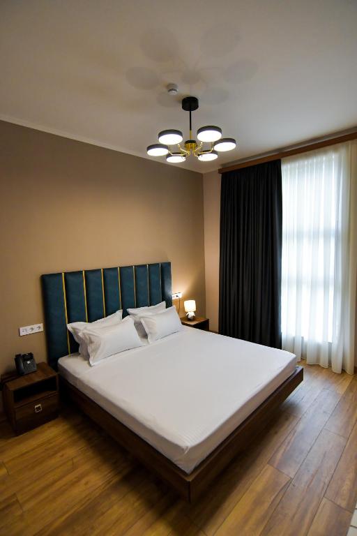 Postel nebo postele na pokoji v ubytování Gelati Residence
