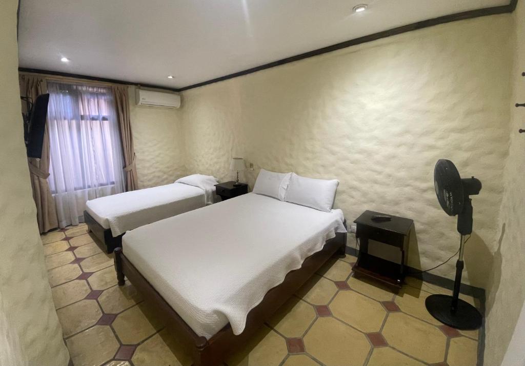 Hotel 1915 INN & SUITESにあるベッド