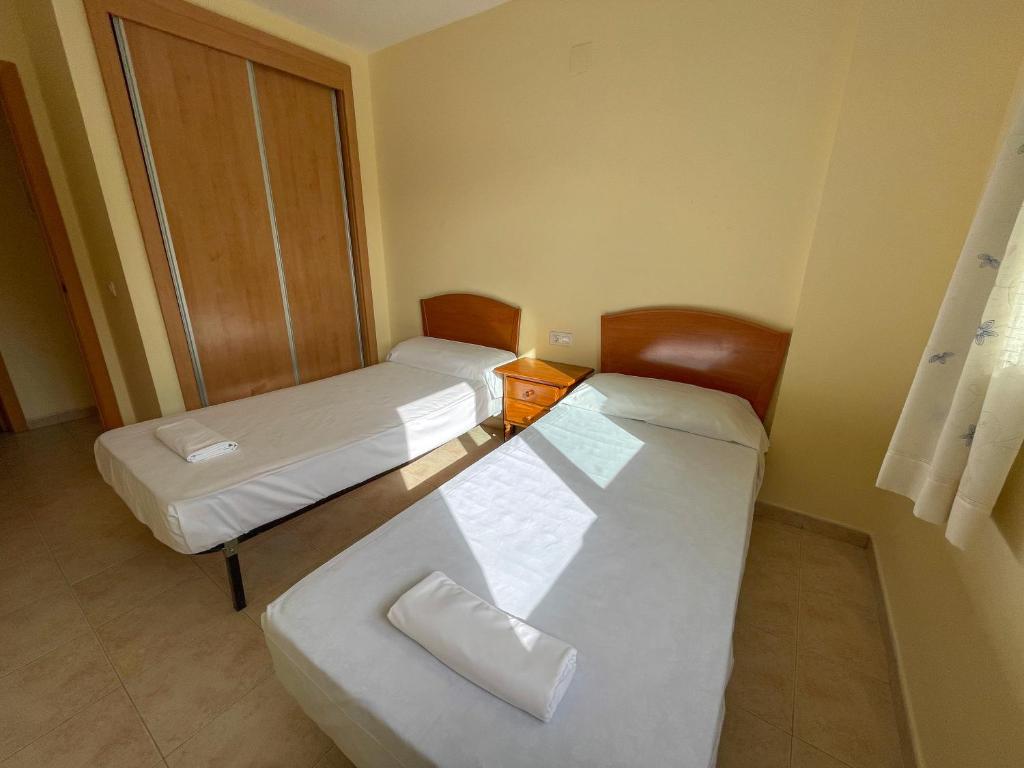 Postel nebo postele na pokoji v ubytování Oropesa Ciudad de Vacaciones 3000