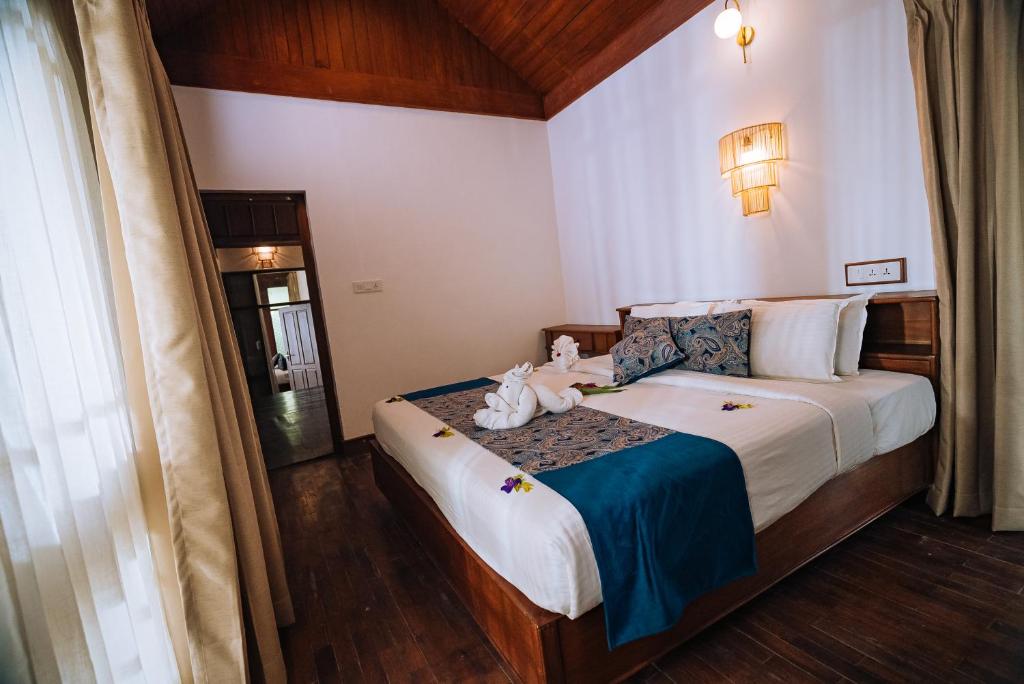 Postel nebo postele na pokoji v ubytování Elixir Woods Luxury Resort And Spa, Munnar