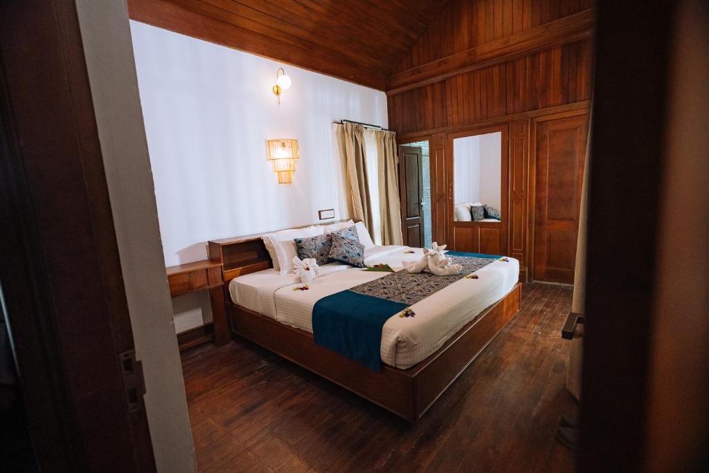 Postel nebo postele na pokoji v ubytování Elixir Woods Luxury Resort And Spa, Munnar