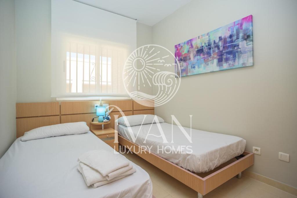 Posteľ alebo postele v izbe v ubytovaní Casa Rafael Ivan Luxury Homes 11ªPlta Sur 1ªLínea