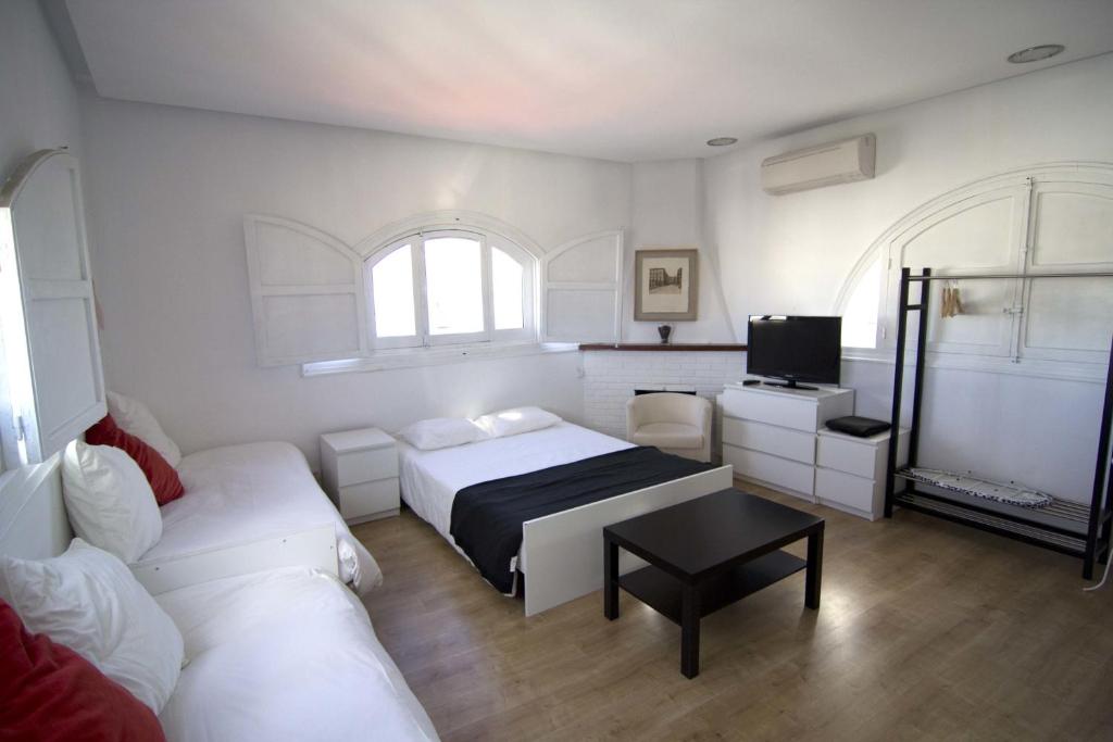 Postel nebo postele na pokoji v ubytování Torreon Sol Apartment