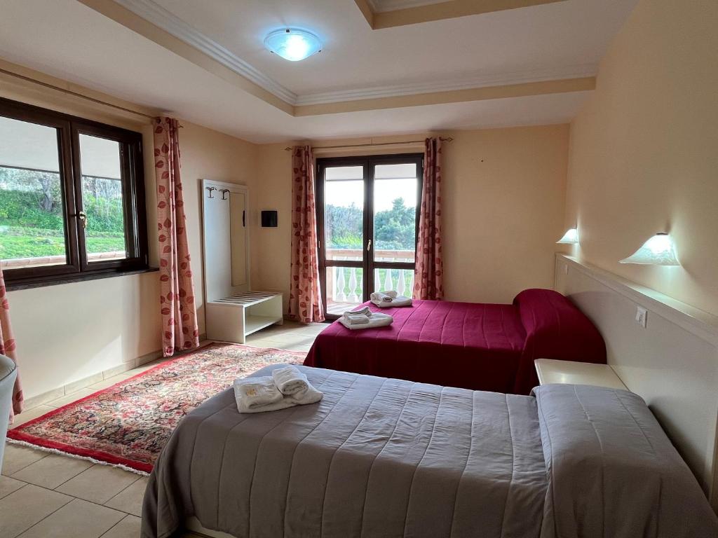 A bed or beds in a room at Residenza Domus Aurea Tropea- Vista Mare