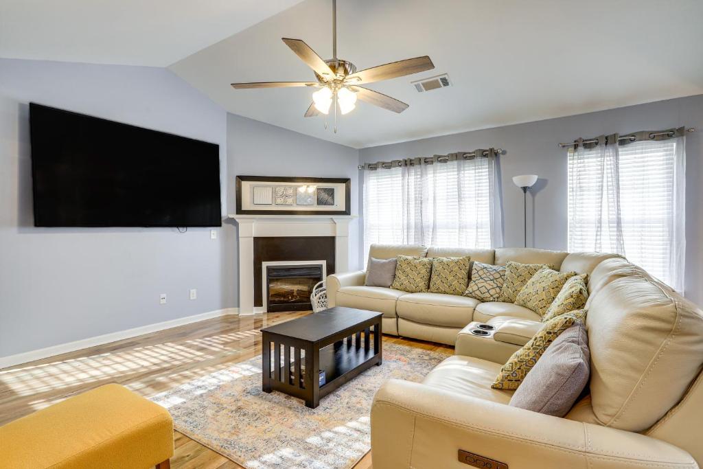 a living room with a couch and a flat screen tv at Fayetteville Vacation Rental about 24 Mi to Atlanta! in Fayetteville