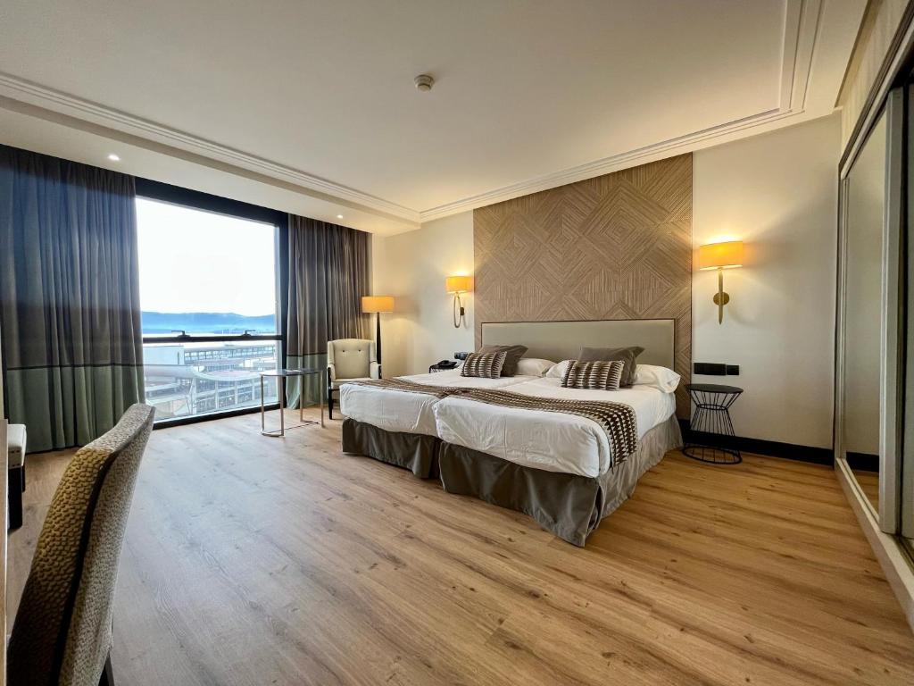 Postel nebo postele na pokoji v ubytování Hotel Bahía