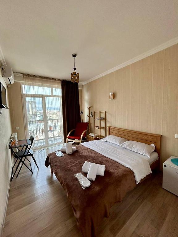 Postel nebo postele na pokoji v ubytování Hotel Marioni