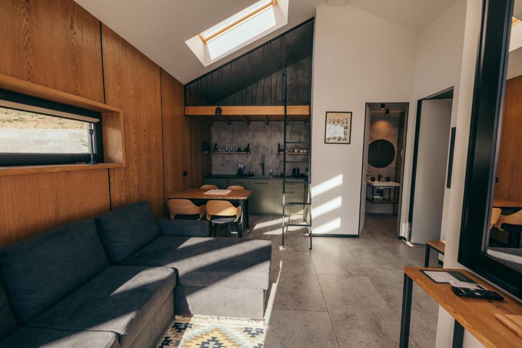 a living room with a couch and a table at Travy in Yaremche