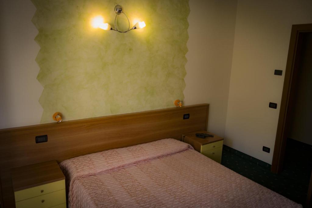 Postel nebo postele na pokoji v ubytování Albergo La Romanella