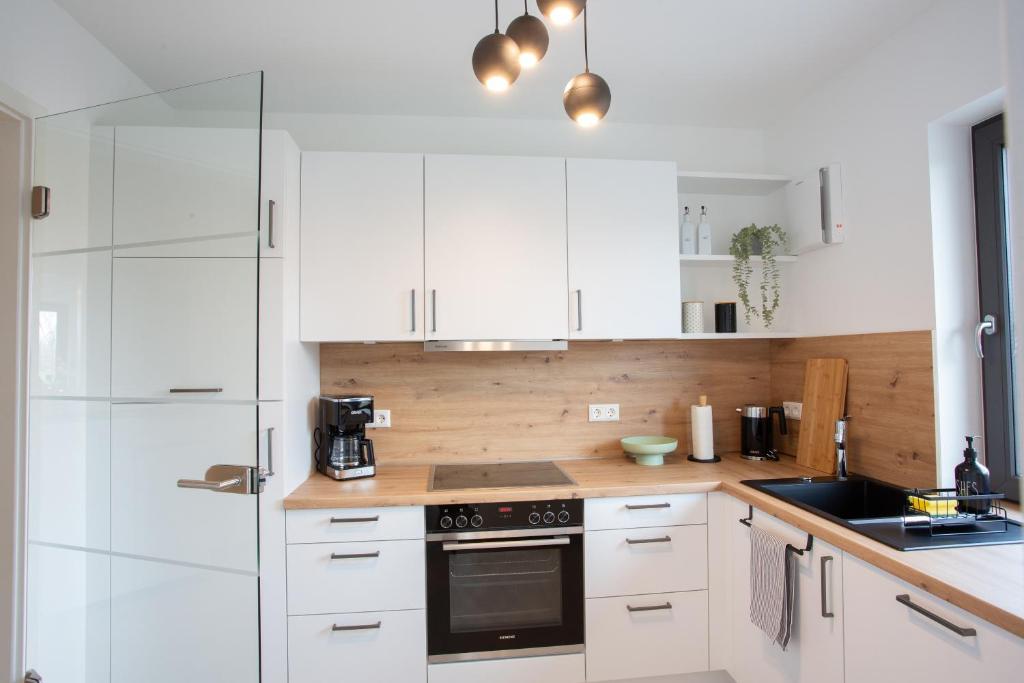 Kuchyň nebo kuchyňský kout v ubytování Siebenschläfer Appartements