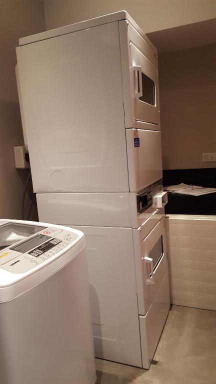 a white refrigerator and a stove in a kitchen at Arevalo 2700 - Las Cañitas in Buenos Aires