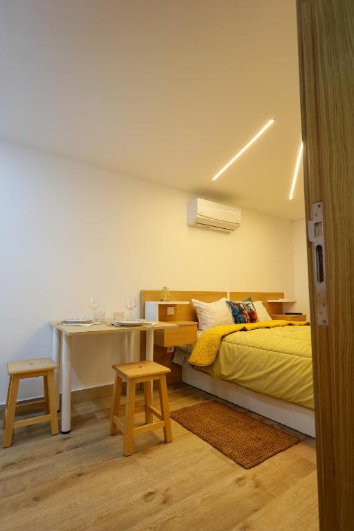 Postel nebo postele na pokoji v ubytování CASA ORIGENS ll