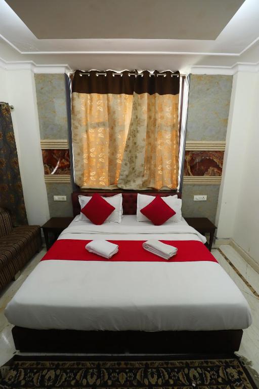 Postel nebo postele na pokoji v ubytování The Hotel Vagmi DLF Gurugram