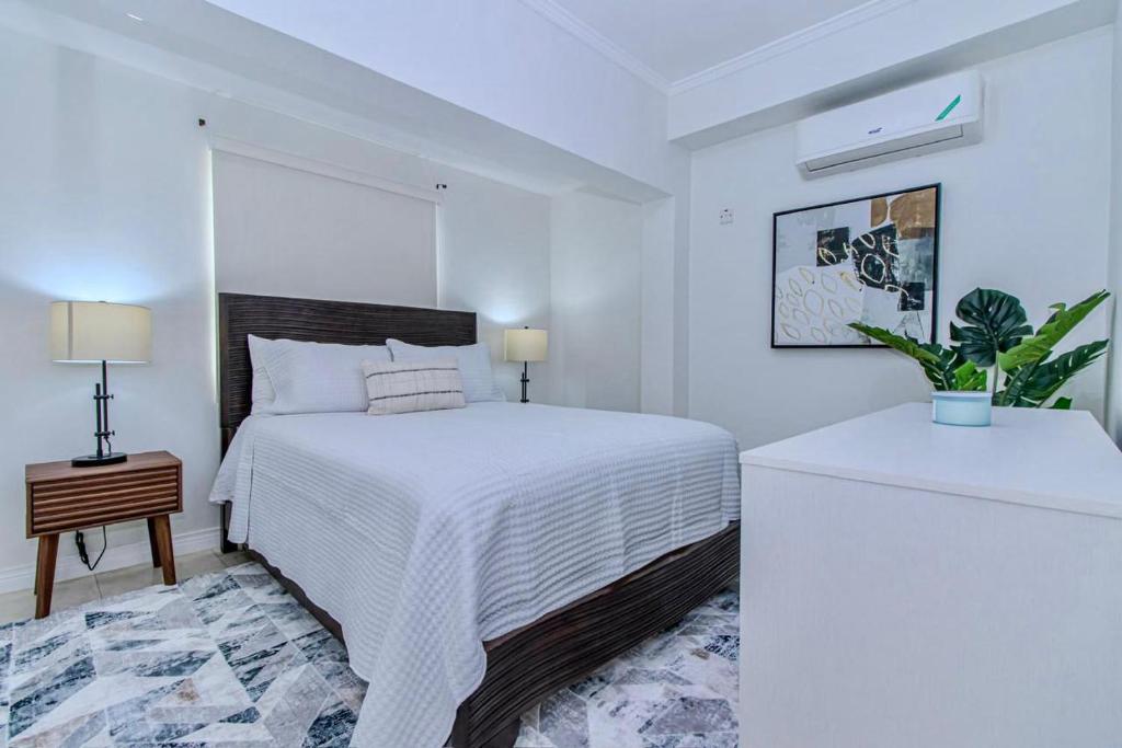 Ένα ή περισσότερα κρεβάτια σε δωμάτιο στο Luxury DreamCondo Bromptons