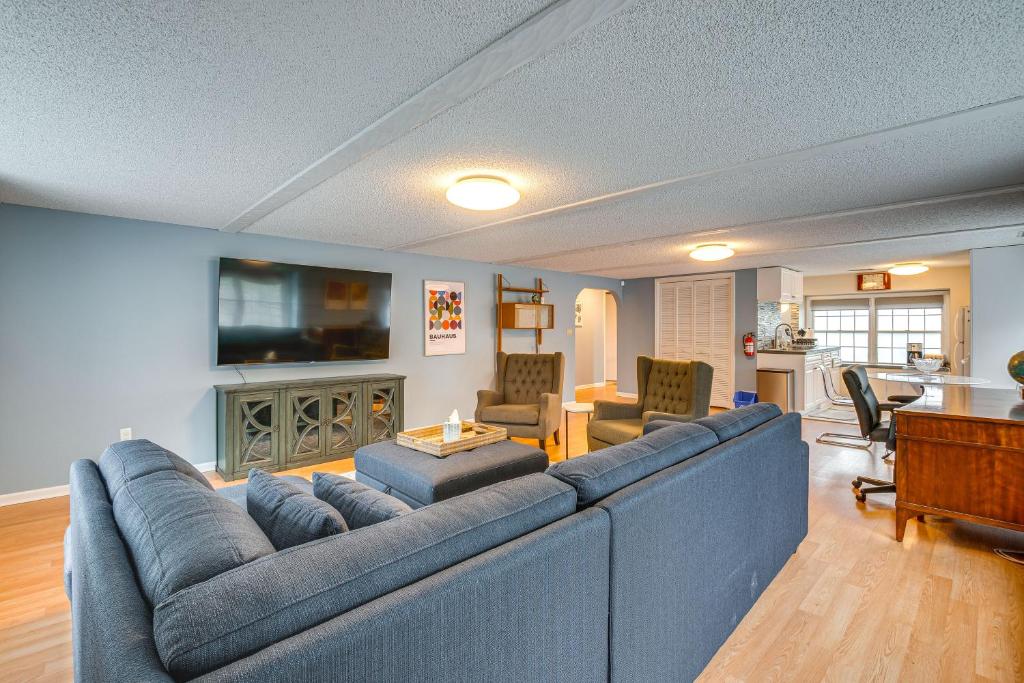 a living room with a blue couch and a tv at 7 Mi to Newark Montclair Vacation Rental in Montclair