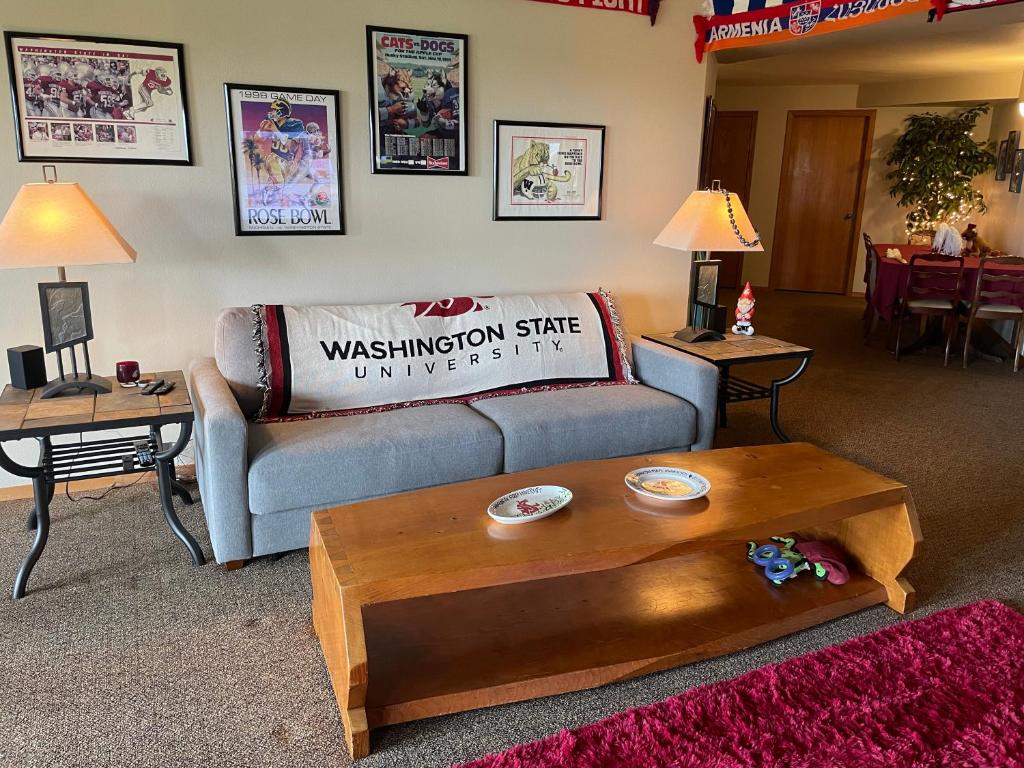 a living room with a couch and a coffee table at The Lair at Crimson House in Pullman