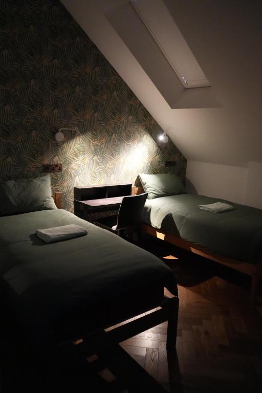 Postel nebo postele na pokoji v ubytování Fountain Hotel