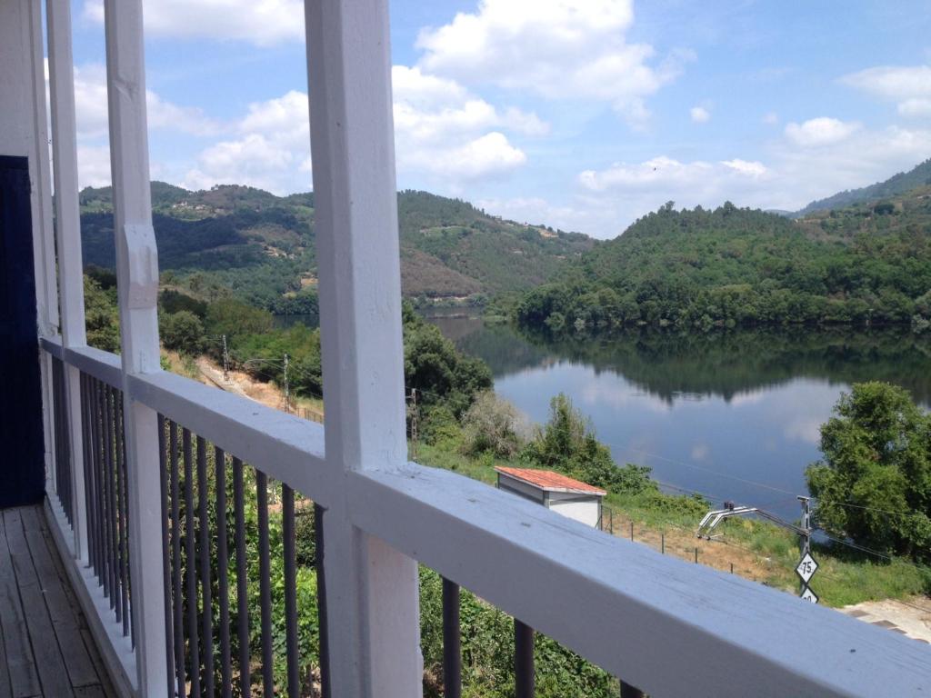 a view of a river from a balcony at Casa de las Ascuas in Ourense