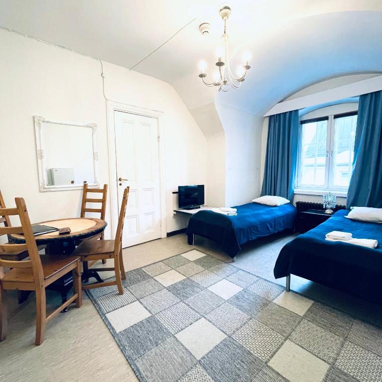 Postel nebo postele na pokoji v ubytování Senate Hotel