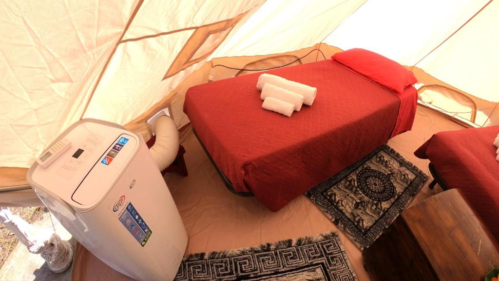 Postel nebo postele na pokoji v ubytování Gole Alcantara mini Glamping Lanternavacanze