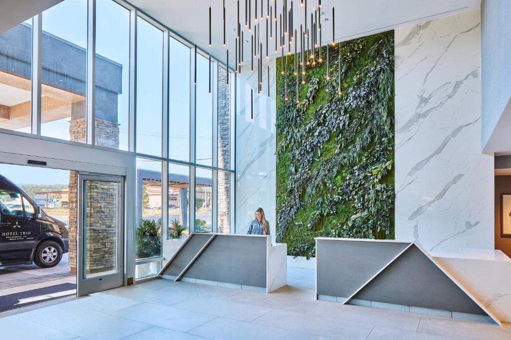 a lobby of a building with a person standing in it at Hotel Trio Healdsburg in Healdsburg