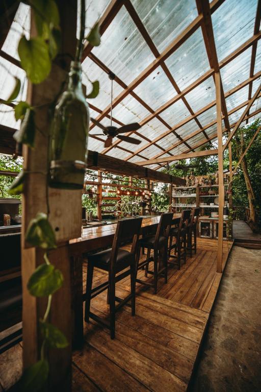 a patio with chairs and a table with a roof at ZÂRIA Hotel & Retreat Center in El Valle