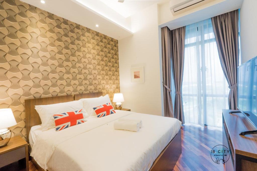 Postel nebo postele na pokoji v ubytování Grand Medini Suites by RR JBcity