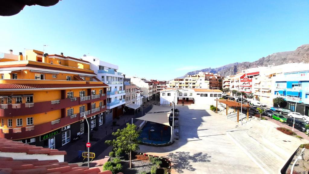 a view of a street in a city with buildings at Puerto Santiago Plaza in Puerto de Santiago