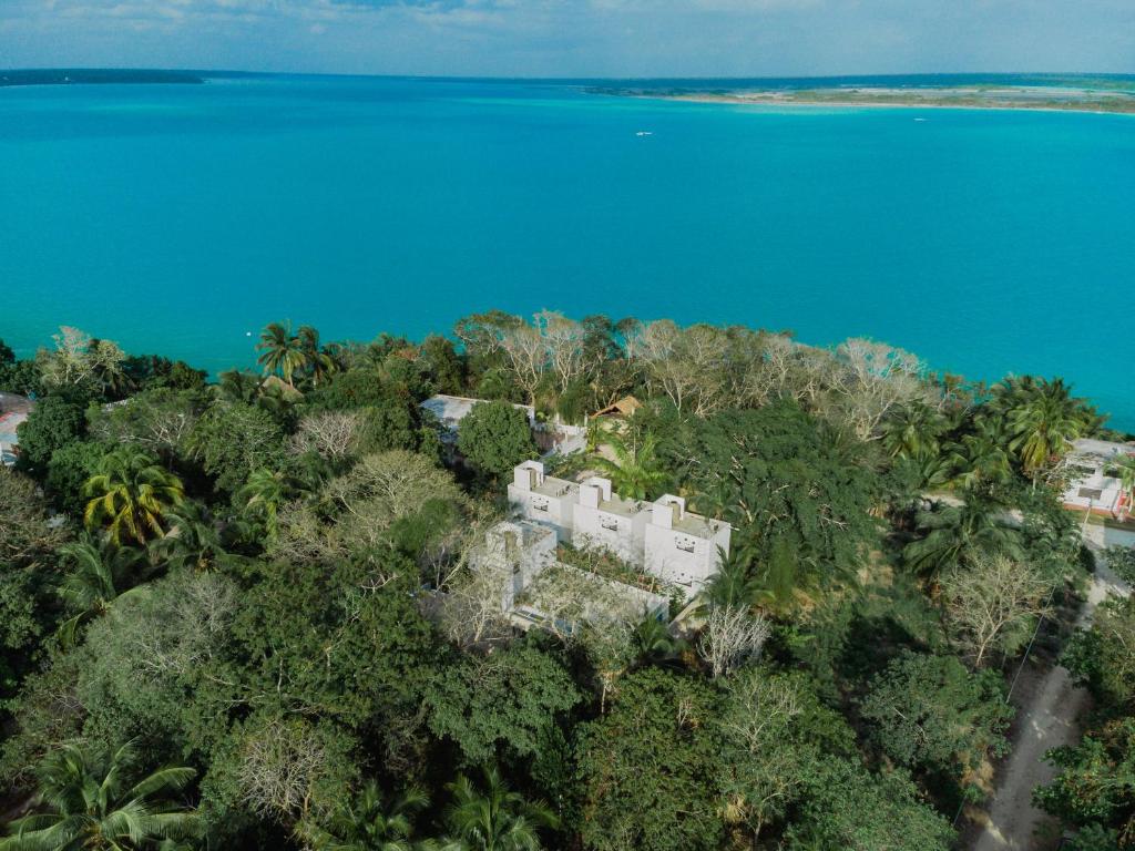 an aerial view of a resort on a tropical island at Maison Bacalar in Bacalar