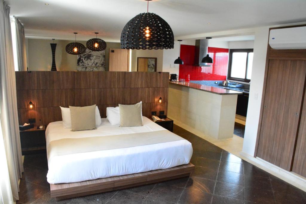 Postel nebo postele na pokoji v ubytování Ilo Rojo Hotel Boutique