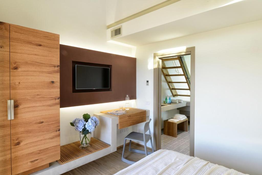 Телевизор и/или развлекательный центр в Resort Il Gallo Senone