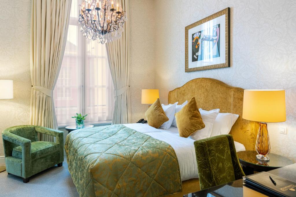 Postel nebo postele na pokoji v ubytování Grand Hotel Casselbergh