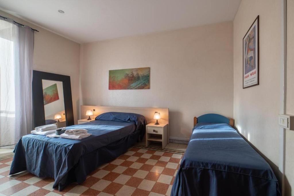 Postel nebo postele na pokoji v ubytování Reyes Suite & Rooms