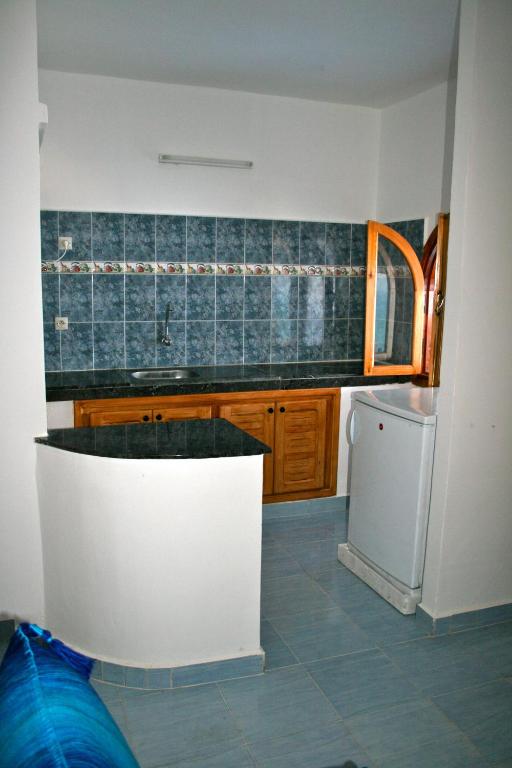 Kuchyň nebo kuchyňský kout v ubytování Appart Hôtel La Planque