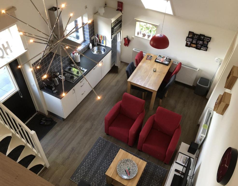 an overhead view of a kitchen and a living room at Appartement Pieterom in Sleen