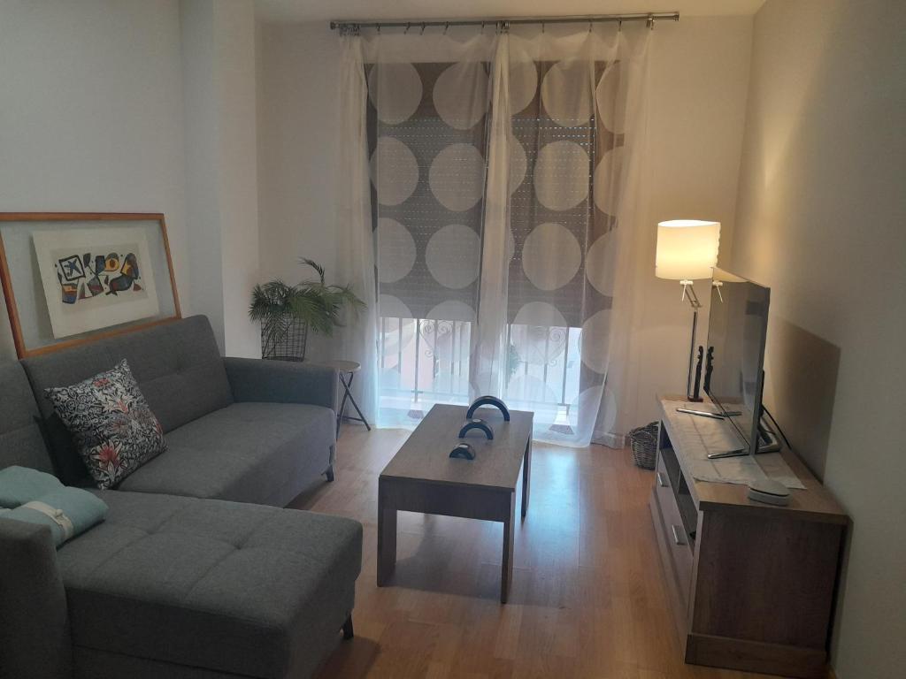 a living room with a couch and a coffee table at IM80 in Montroig