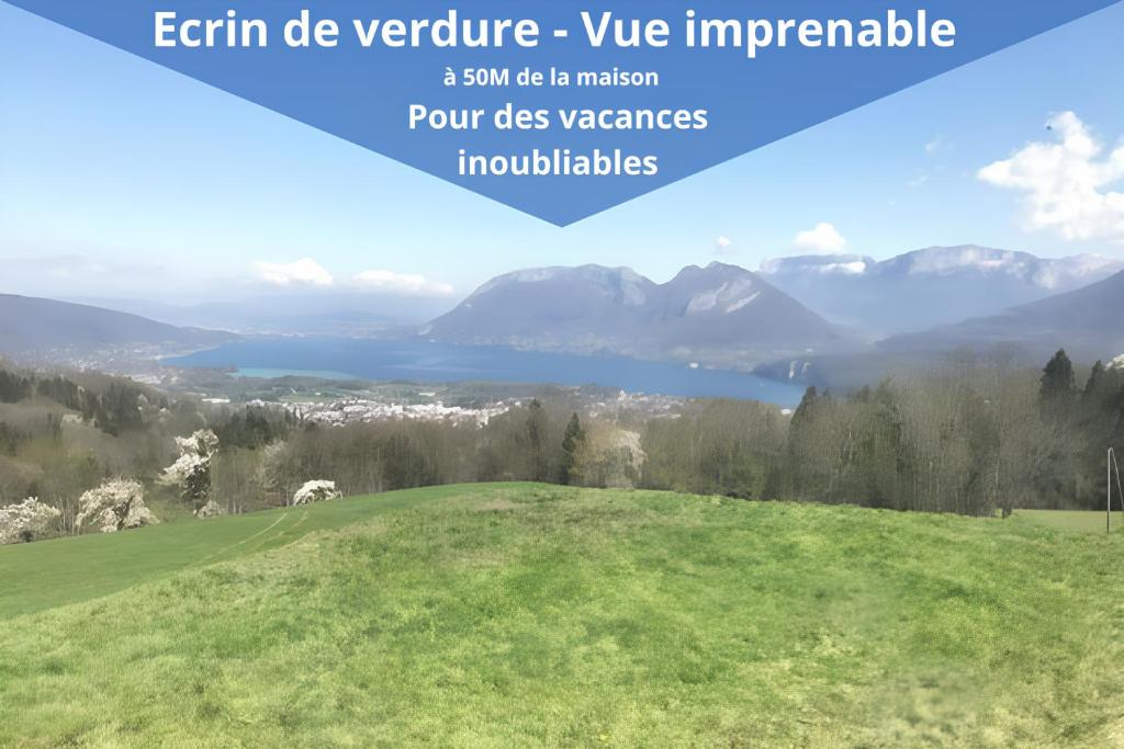a view of a green hill with mountains in the background at Évasion familiale entre Lac Annecy & Massif Bauges in Saint-Eustache