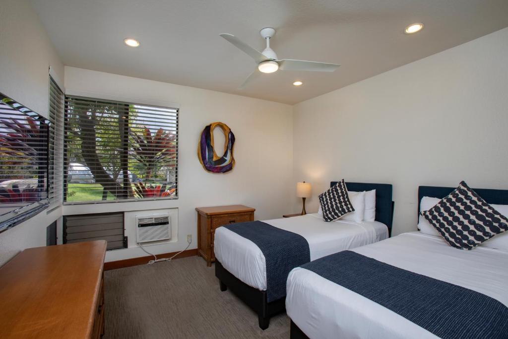 Postel nebo postele na pokoji v ubytování Wailea Grand Champions Villas - CoralTree Residence Collection