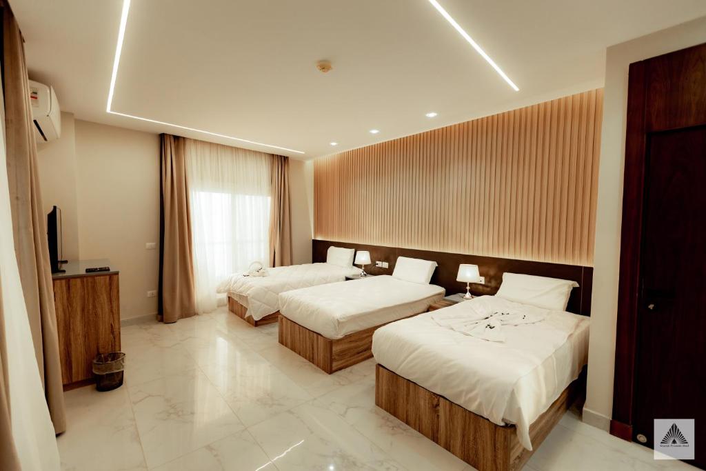 En eller flere senger på et rom på Khattab Pyramids View Hotel