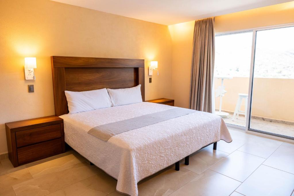 Postel nebo postele na pokoji v ubytování Hotel Balcón del Cielo