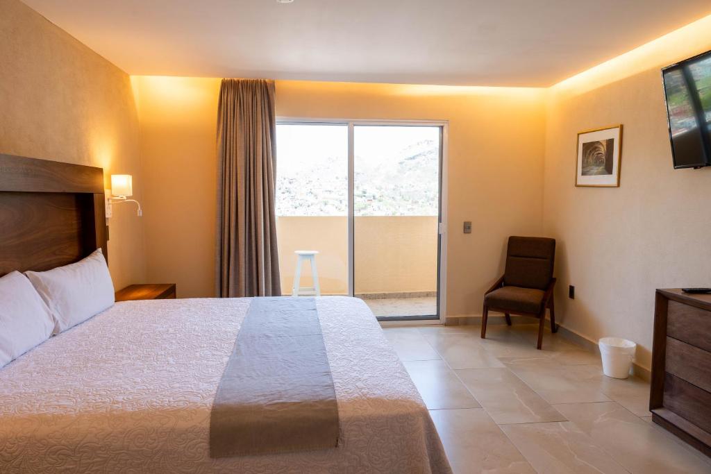 Postel nebo postele na pokoji v ubytování Hotel Balcón del Cielo