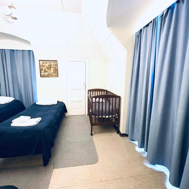 Postel nebo postele na pokoji v ubytování Senate Hotel