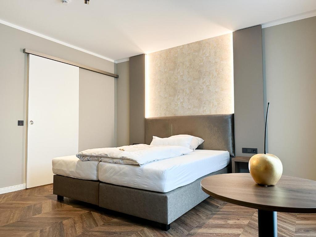 Postel nebo postele na pokoji v ubytování Hotel Restaurant Hackmann-Atter